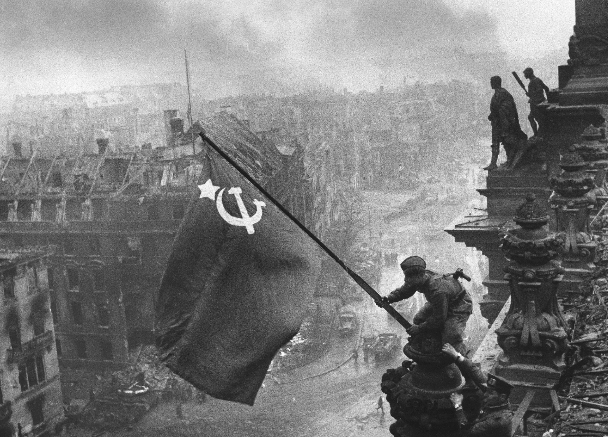 The iconic "Raising a flag over the Reichstag" in Berlin, 1945. 